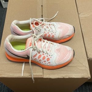 Woman’s Nike running shoes white and orange